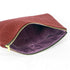 Red textured large zip pouch with a purple interior and gold zipper on a white background named after Shavonne