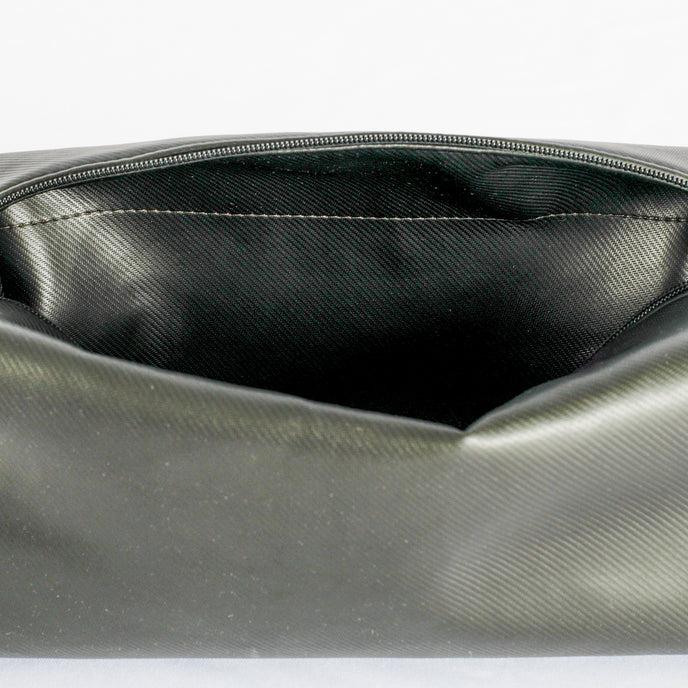 A black wipe-clean interior with gold seam on a white background named after Sherry