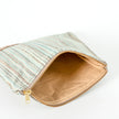 Striped pouch with a beige interior on a white background named after Sherry 
