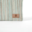 Striped fabric with a 'Unshattered' brand label on a white background named after Sherry