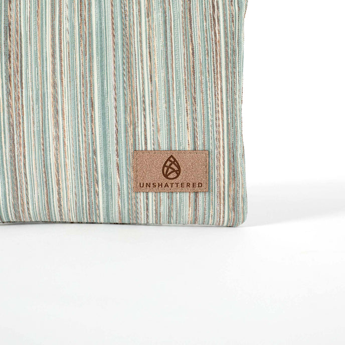 Striped fabric with a 'Unshattered' brand label on a white background named after Sherry