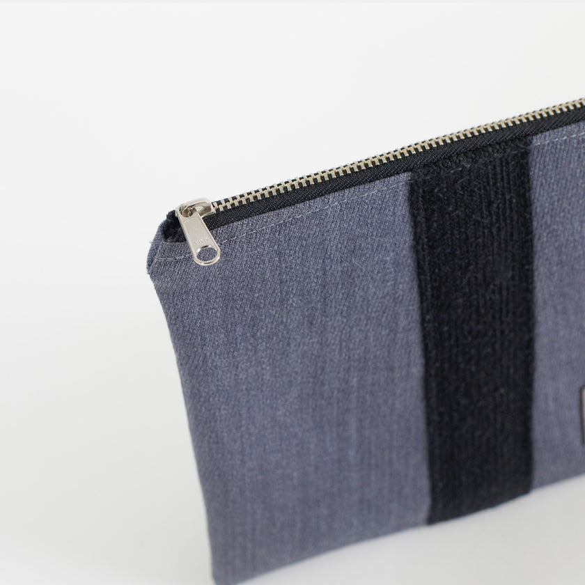 A silver tone zipper on a West Point zip pouch 