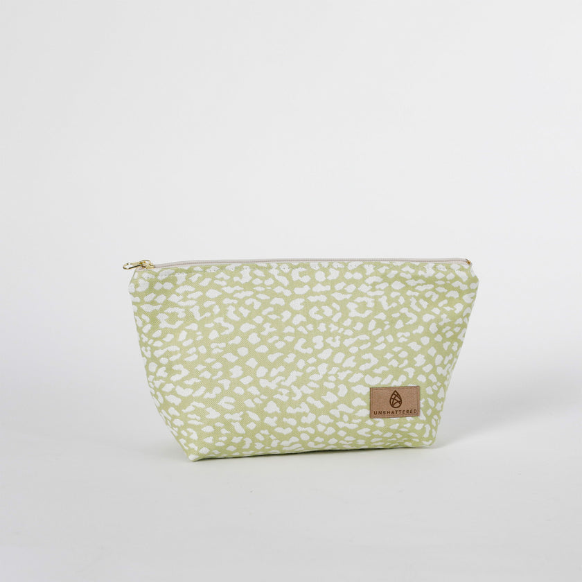 Green patterned pouch with a tan label  on a white background named after Sky 