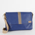 A blue Southwest classic messenger bag with a tan stripe in the center 