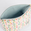A light blue luxury leather alternative interior with a gold seam on a confetti puff plush makeup kit 