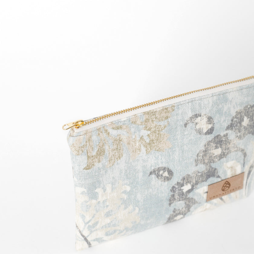 Floral patterned pouch with gold zipper on a white background named after Suzanne 