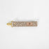 This beige fabric wristlet key clip features a playful dotted pattern and sleek gold-tone hardware.