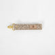 This beige fabric wristlet key clip features a playful dotted pattern and sleek gold-tone hardware.