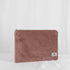 A large zip pouch with a mauve velvet exterior and a floral interior, featuring a zip closure and gold-tone hardware.