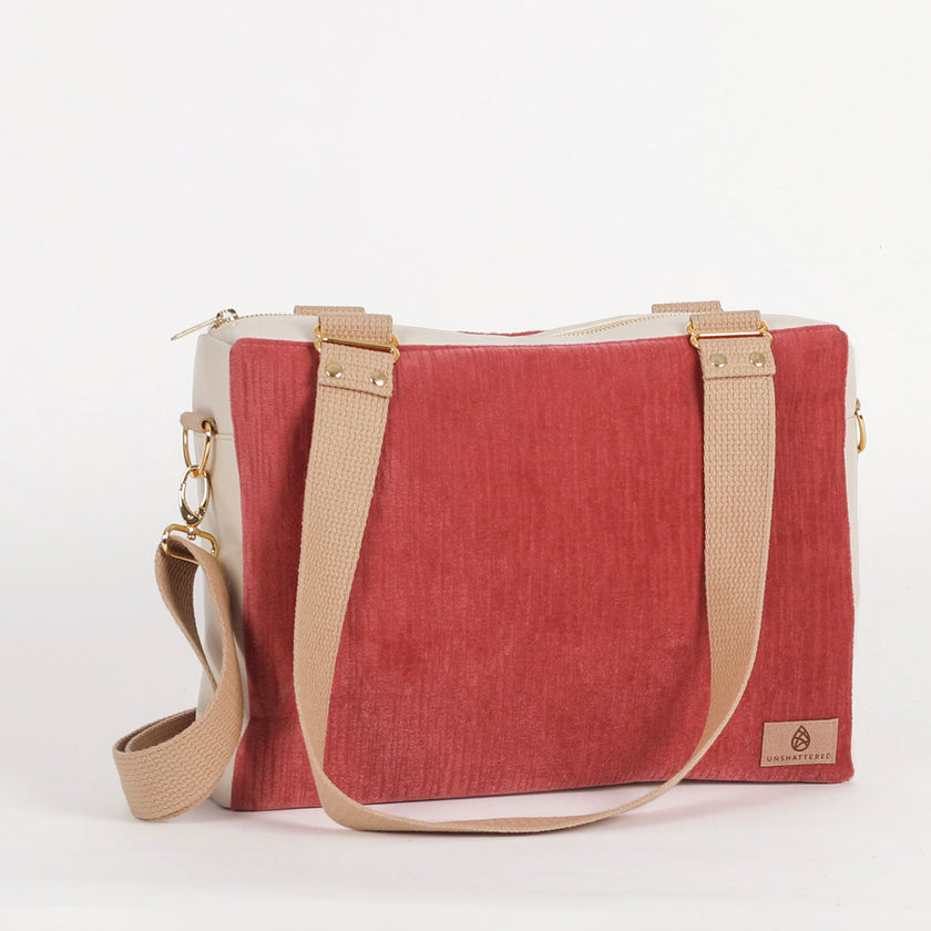 Red handbag with beige straps on a white background named after Tisha 