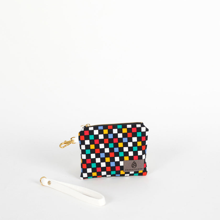 Multicolored checkered pouch with a strap on a white background