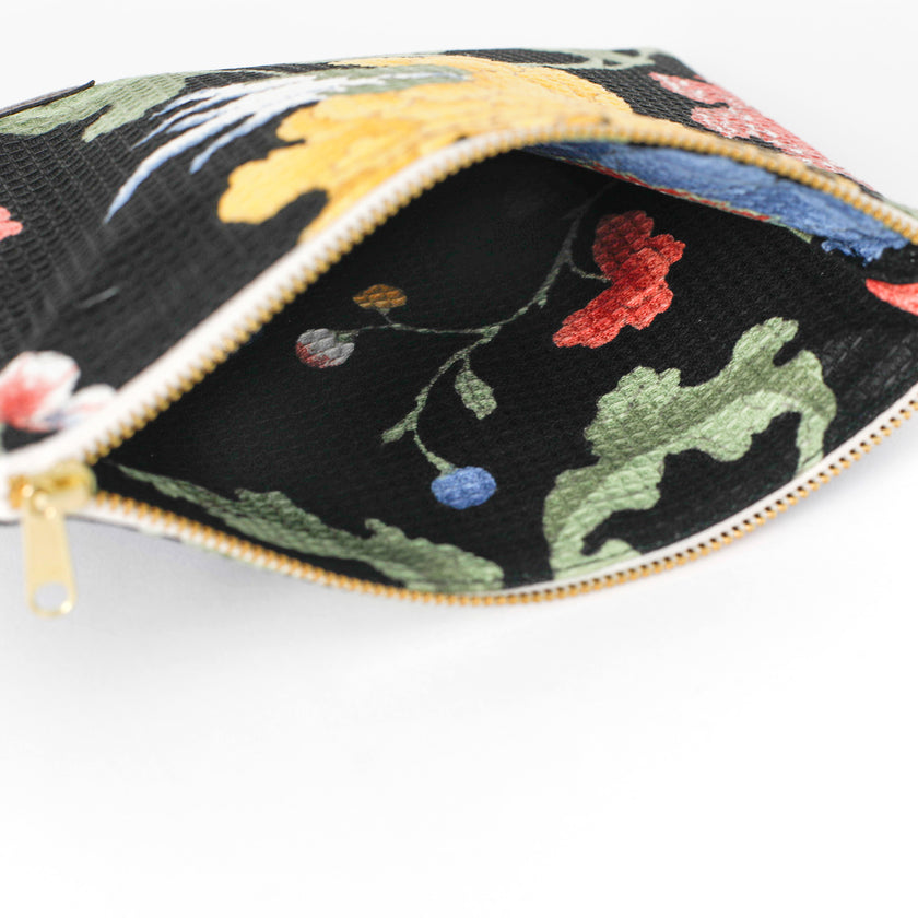 Upcycled floral-patterned fabric interior of an Unshattered zippered pouch named Felicia 
