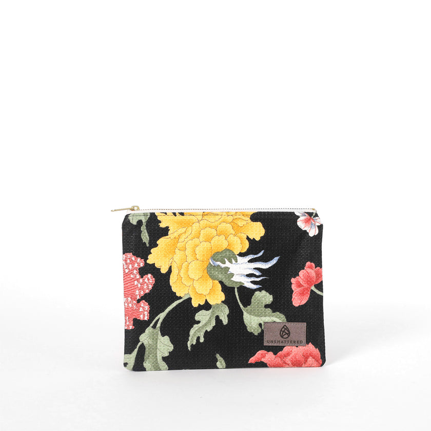 Upcycled floral-patterned fabric pouch named Felicia on a white background 