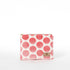 Pink polka dot pouch with a gold zipper on a white background