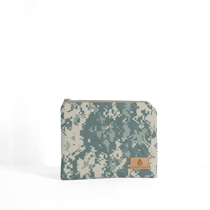 A small zip pouch with an army digital camouflage pattern, featuring a tan label and gold-tone hardware.