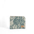 A small zip pouch with an army digital camouflage pattern, featuring a tan label and gold-tone hardware.