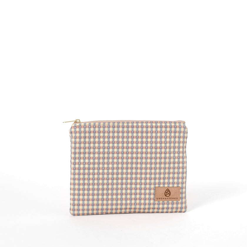 Zippered pouch named after Kara and handcrafted from upcycled checked fabric by women in recovery
