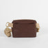Brown vegan leather bag with pocket and beige cotton strap on a white background