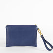 A blue anniversary wristlet back view with a wristlet strap and gold teardrop clip.