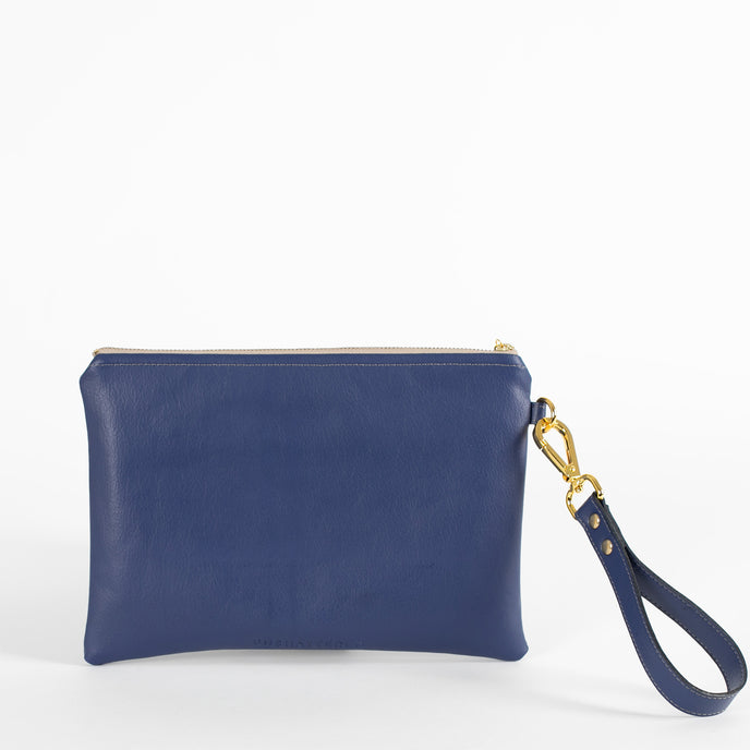A blue anniversary wristlet back view with a wristlet strap and gold teardrop clip.