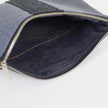 A black interior with a gold seam on a West Point pouch 