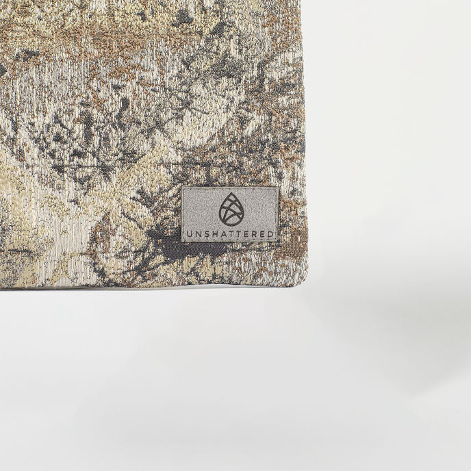 A gray label on a metal pattern pouch named after Crystal 