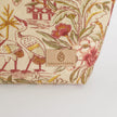 Fabric with floral and bird pattern and 'Unshattered' brand label on a white background named after Anitha 