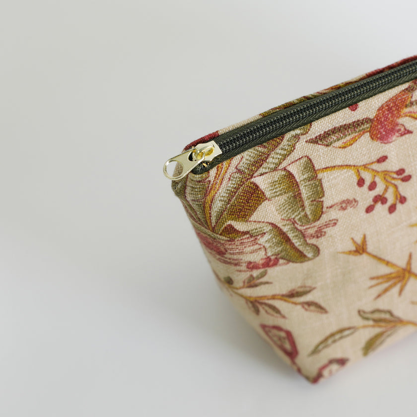 Floral-patterned pouch with a zipper on a white background named after Anitha 