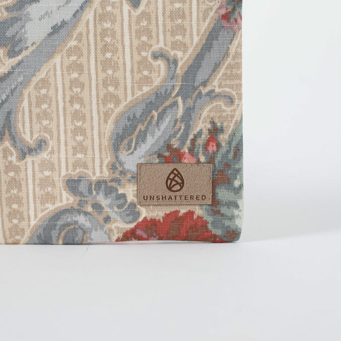 A tan label on this floral tan print fabric 