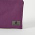 A gray label on a purple zip pouch named after Connie 
