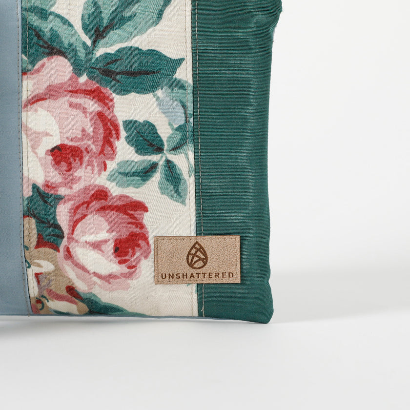A tan label on a multi-panel crossbody named after Nadiya 