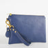 A detail shot of the wristlet and gift with purchase keychain.