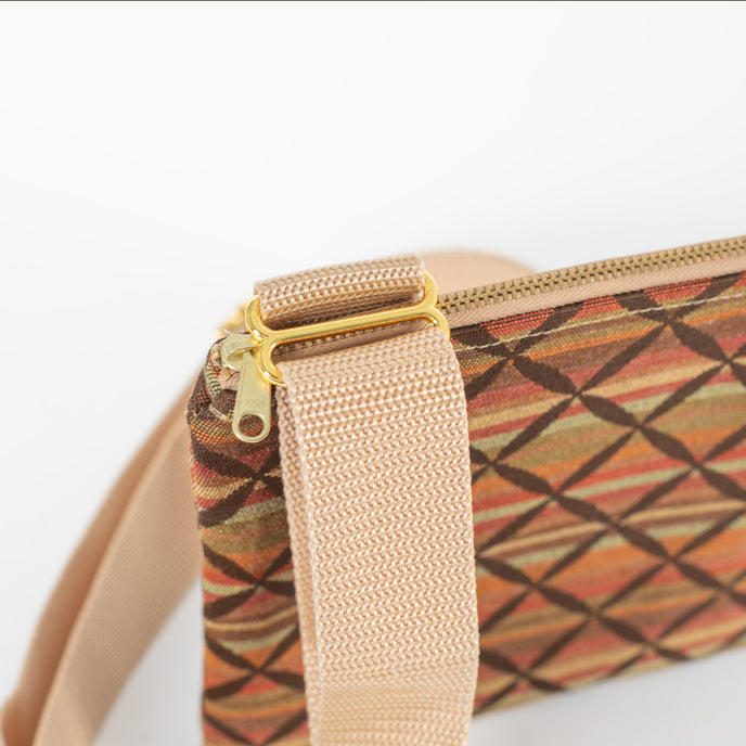 A detail shot of the gold hardware on this Heather crossbody 