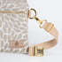 a detail shot of the gold belt bag clip 
