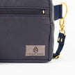 Navy blue errand bag with a visible brand logo on a white background named after Adam 