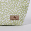 Green fabric with white pattern and 'Unshattered' brand logo on a white background named after Sky 