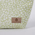 Green fabric with white pattern and 'Unshattered' brand logo on a white background named after Sky 