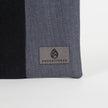 A gray Unshattered label on a West Point dress gray zip pouch 