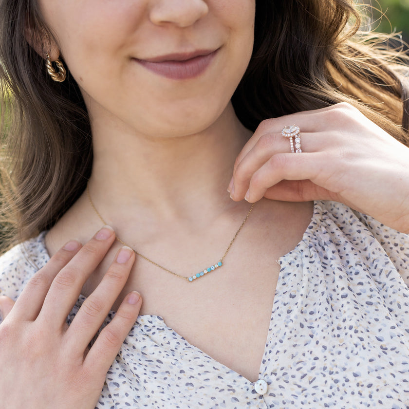 model wearing Chloe + Lois necklace